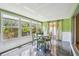 Inviting sun room with lots of natural light and backyard views at 93 Boca Ciega Point N Blvd # 93, St Petersburg, FL 33708