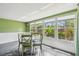 Bright sun room features lots of windows with natural light and backyard views at 93 Boca Ciega Point N Blvd # 93, St Petersburg, FL 33708