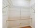 This walk-in closet has wire shelving and a wooden rod for optimal storage at 93 Boca Ciega Point N Blvd # 93, St Petersburg, FL 33708