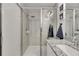 Bathroom features granite countertops, white cabinetry, and walk-in shower with glass enclosure at 9665 Sweetwell Pl, Riverview, FL 33569