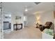 Loft with neutral carpet, fan, seating, and access to the laundry room at 9665 Sweetwell Pl, Riverview, FL 33569