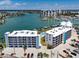 Drone view of condo and waterfront community with dockage and pool in Treasure Island Florida at 9815 Harrell Ave # 503, Treasure Island, FL 33706