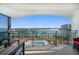 Balcony with chairs overlooking the intercoastal waterway, docks, and community pool at 9815 Harrell Ave # 503, Treasure Island, FL 33706