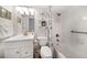 Updated bathroom with shower-tub combo, modern vanity, and nautical accents at 9815 Harrell Ave # 503, Treasure Island, FL 33706