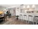 Open floor plan showcases the living room with a breakfast bar leading into the kitchen at 9815 Harrell Ave # 503, Treasure Island, FL 33706