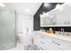 Modern bathroom with freestanding tub, glass enclosed shower, and double sink vanity at 10357 Lightner Bridge Dr, Tampa, FL 33626