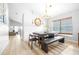 Bright dining area with stylish furnishings, modern lighting, and backyard views at 10357 Lightner Bridge Dr, Tampa, FL 33626