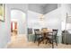 Cozy dining area nook with wood table, stylish light fixture, and built-in bench seating at 10357 Lightner Bridge Dr, Tampa, FL 33626