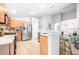 Modern kitchen with stainless steel appliances, island seating, and stylish finishes at 10357 Lightner Bridge Dr, Tampa, FL 33626