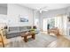 Open-concept living room featuring a cozy seating arrangement, backyard views, and abundant light at 10357 Lightner Bridge Dr, Tampa, FL 33626
