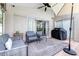 Relaxing covered patio with ceiling fan, grill, and patio furniture at 10357 Lightner Bridge Dr, Tampa, FL 33626