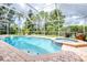 Screened-in pool with integrated spa and brick paver pool deck at 10357 Lightner Bridge Dr, Tampa, FL 33626
