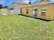 Spacious backyard with lush green grass, shed, and fenced perimeter providing privacy and outdoor enjoyment at 10607 Boyette Creek Blvd, Riverview, FL 33569