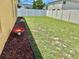 Well-maintained backyard featuring a fence and landscaping, creating a serene outdoor space for relaxation at 10607 Boyette Creek Blvd, Riverview, FL 33569