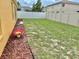 The spacious backyard is enclosed by a white vinyl fence for ultimate privacy at 10607 Boyette Creek Blvd, Riverview, FL 33569
