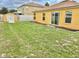 A large, grassy backyard offers ample space, featuring a useful storage shed at 10607 Boyette Creek Blvd, Riverview, FL 33569