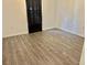 Bedroom featuring luxury vinyl flooring and modern fixtures, offering comfort and style at 10607 Boyette Creek Blvd, Riverview, FL 33569