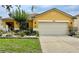 Charming one-story home with attached two-car garage, lush landscaping, and curb appeal at 10607 Boyette Creek Blvd, Riverview, FL 33569