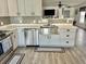 Bright kitchen features stainless steel appliances, updated counters, and a stylish backsplash at 10607 Boyette Creek Blvd, Riverview, FL 33569