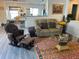 Inviting living room featuring an open floor plan, laminate floors, and comfortable seating at 10607 Boyette Creek Blvd, Riverview, FL 33569
