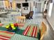 Open-concept floor plan connecting the kitchen, dining, and living areas. Laminate floors throughout at 10607 Boyette Creek Blvd, Riverview, FL 33569