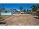 Spacious backyard, featuring a playhouse and slide, plus a detached garage at 1101 Essex N Dr, St Petersburg, FL 33710