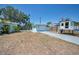 This fully-fenced backyard features a garage, and a playhouse with slide, perfect for  at 1101 Essex N Dr, St Petersburg, FL 33710