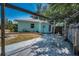The backyard features a wooden pergola, patio, and well-maintained lawn at 1101 Essex N Dr, St Petersburg, FL 33710