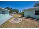Enjoy the backyard with an outdoor fire pit area, perfect for entertaining and relaxation at 1101 Essex N Dr, St Petersburg, FL 33710