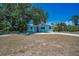 Charming single-story home with a well-manicured lawn and mature trees creating an inviting curb appeal at 1101 Essex N Dr, St Petersburg, FL 33710
