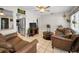 Bright living space featuring tile floors, comfortable seating, and seamless access to the adjacent kitchen at 1101 Essex N Dr, St Petersburg, FL 33710