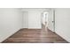 Spacious bedroom featuring wood-look floors and ample closet space at 1108 E Annie St, Tampa, FL 33612