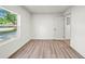 Minimalist bedroom with wood flooring and abundant natural light at 1108 E Annie St, Tampa, FL 33612