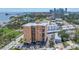 Aerial view of the high-rise building showcasing downtown in the background and surrounding palm trees at 1120 N Shore Ne Dr # 804, St Petersburg, FL 33701
