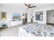 Bright bedroom featuring tiled floor, ceiling fan, mounted TV, and vanity at 1120 N Shore Ne Dr # 804, St Petersburg, FL 33701