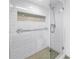 Close up of the shower stall featuring glass enclosure, a shower head, and white tile at 1120 N Shore Ne Dr # 804, St Petersburg, FL 33701
