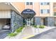 The Normandy entrance boasts a classic awning, stone accents, and well-maintained landscaping at 1120 N Shore Ne Dr # 804, St Petersburg, FL 33701