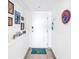 Bright hallway adorned with personal art and a welcoming beach-themed welcome mat at 1120 North Shore Ne Dr # 804, St Petersburg, FL 33701
