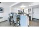 Stylish kitchen with breakfast bar, pendant lighting, tiled backsplash, and stainless steel appliances at 1120 North Shore Ne Dr # 804, St Petersburg, FL 33701