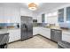 Bright kitchen featuring white cabinets, stainless steel appliances, and modern countertops at 1120 N Shore Ne Dr # 804, St Petersburg, FL 33701
