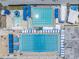 Aerial view of community swimming pools with blue canopies and ample deck space at 1120 N Shore Ne Dr # 804, St Petersburg, FL 33701