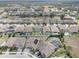 A high-angle view of a residential community, showcasing rooftops and well-kept lawns at 11222 Hawks Fern Dr, Riverview, FL 33569