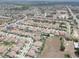 Aerial view of a housing area with green lawns, roadways, sidewalks, and houses with solar panels at 11222 Hawks Fern Dr, Riverview, FL 33569