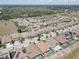 Wide aerial view of a residential area with orderly streets, manicured lawns, and various home styles at 11222 Hawks Fern Dr, Riverview, FL 33569