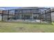 Well-maintained backyard featuring a screened-in pool and patio at 11222 Hawks Fern Dr, Riverview, FL 33569