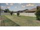 Manicured lawn with vibrant greenery, enclosed by a privacy fence at 11222 Hawks Fern Dr, Riverview, FL 33569
