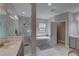 Elegant bathroom featuring a glass enclosed shower and luxurious soaking tub with granite counters and marble tile at 11222 Hawks Fern Dr, Riverview, FL 33569