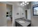 Bathroom featuring granite counters, a sink, a mirror, and a window at 11222 Hawks Fern Dr, Riverview, FL 33569