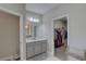 Bathroom featuring marble floors, granite counters, and a closet with lots of space at 11222 Hawks Fern Dr, Riverview, FL 33569