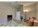 Bright bedroom with a tropical-themed bed, a TV and a comfortable chair with a standing lamp at 11222 Hawks Fern Dr, Riverview, FL 33569